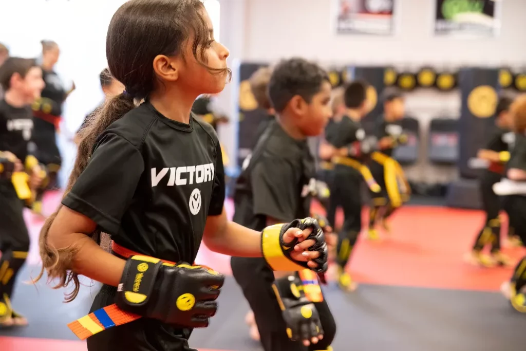 Girl in Focus With Other Kids Behind During the Martial Arts Class for Kids in Summerlin, Nevada